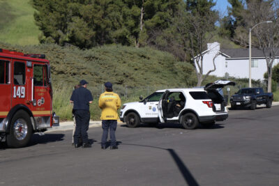 Los Angeles County Medical Examiner officials investigate the traffic collision on the intersection of Pinto Place and Green Hill Drive in Castaic, Calif., Wednesday, March 11, 2026. Kamryn Martell/The Signal