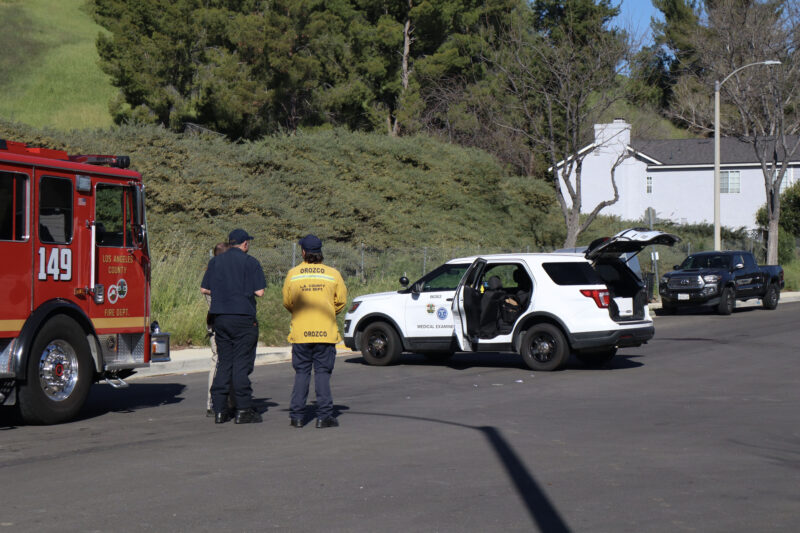 Los Angeles County Medical Examiner officials investigate the traffic collision on the intersection of Pinto Place and Green Hill Drive in Castaic, Calif., Wednesday, March 11, 2026. Kamryn Martell/The Signal