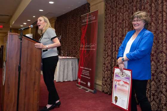 Los Angeles County Supervisor Kathryn Barger delivers remarks honoring Lucy Jones during the Los Angeles County Commission for Women's 40th Annual Women of the Year Luncheon as Jones stands beside her. Photo: David Franco/L.A. County.