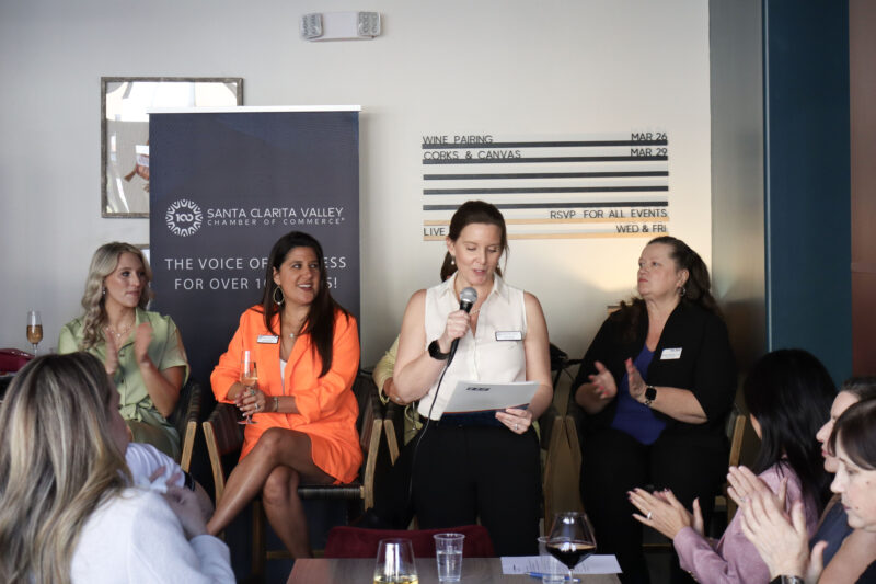 Sarah Wetzel, "InfluenceHER" chair, welcomes attendees at the Santa Clarita Valley Chamber of Commerce's "InfluenceHER: Boardroom Ready" event at Kindred Spirits Wine Bar in Valencia, Calif., Tuesday, March 10, 2026. Kamryn Martell/The Signal