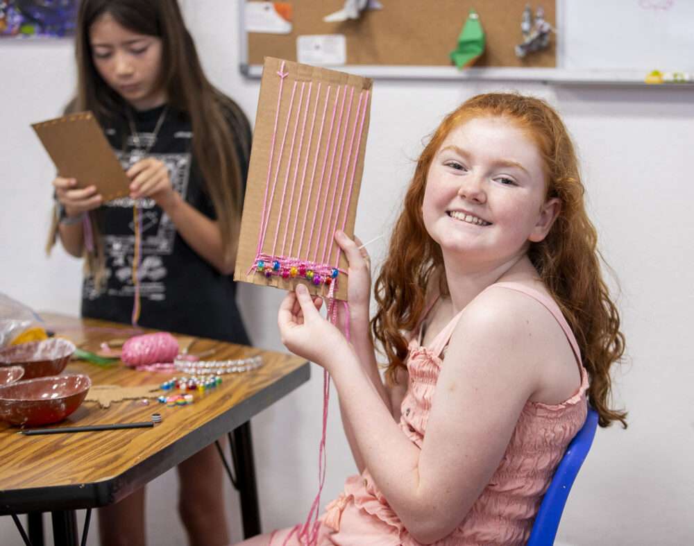 Olivia Beers, 10, shows her cardboard loom with beads during the "Branching Out Open Art Studio" at ARTree Community Arts Center on Saturday, March 14, 2026. Habeba Mostafa/ The Signal
