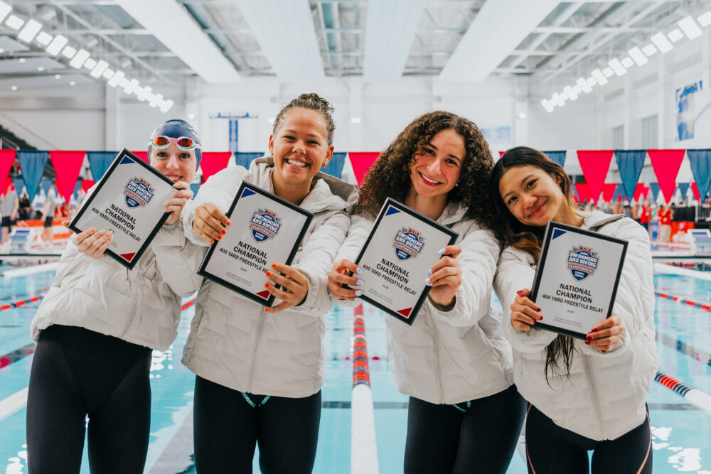 From left: Kylee Sears, Clara Patterson, Katherine Dyer and Megan Sutanto celebrate their win in the NAIA 400-yard freestyle relay in Elkhart, Indiana, this month. Courtesy photo.
