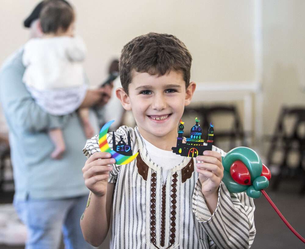 Sami Kokash, 7, holds up his crafts during the Eid prayer at the City of Santa Clarita Activities Center on Friday, March 20, 2026. Habeba Mostafa/ The Signal
