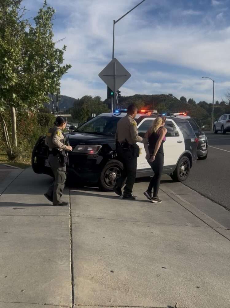 A woman and a man were arrested on suspicion of a stolen vehicle on the intersection of Camp Plenty Road and Soledad Canyon Road on Friday, April 3, 2026. Courtesy of Dillon Foster.