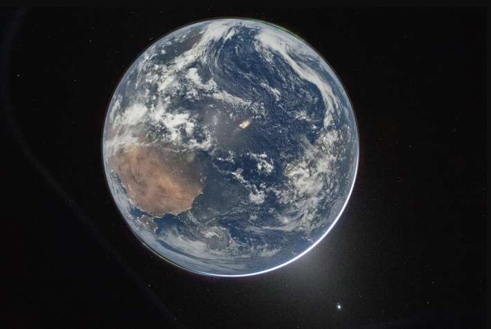 A view of Earth taken by NASA astronaut and Artemis II Commander Reid Wiseman from the Orion spacecraft's window after completing the translunar injection burn on April 2, 2026. NASA