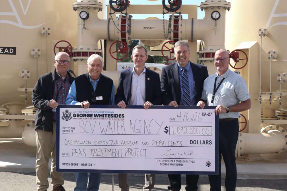 Rep. George Whitesides (center), D-Agua Dulce, presents the check for the federal investment project for clean water in Canyon Country, Calif., Monday, April 6, 2026. Kamryn Martell/The Signal