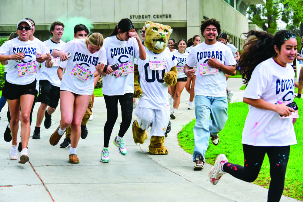 Students dashed through clouds of color during a Holi-inspired color run hosted by the College of the Canyons Intercultural Center on March 31. Courtesy photo.