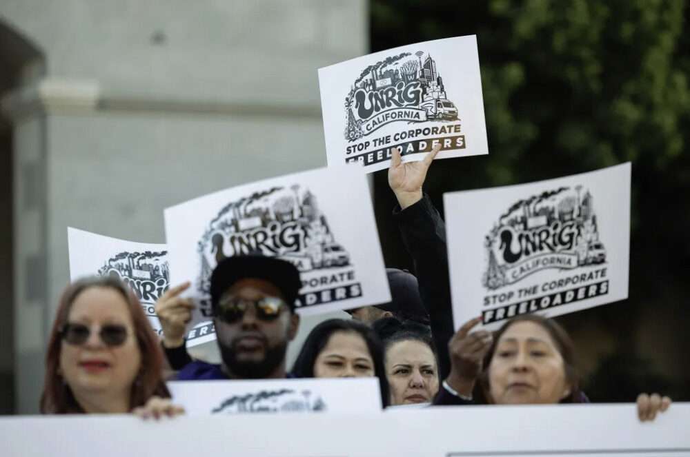 Janitors, nurses, teachers and labor organizers rally at the state Capitol in Sacramento to launch UnRig California on March 11, 2026. The initiative is a multiyear campaign aimed at reforming the state’s economy and tax code. Photo by Miguel Gutierrez Jr., CalMatters