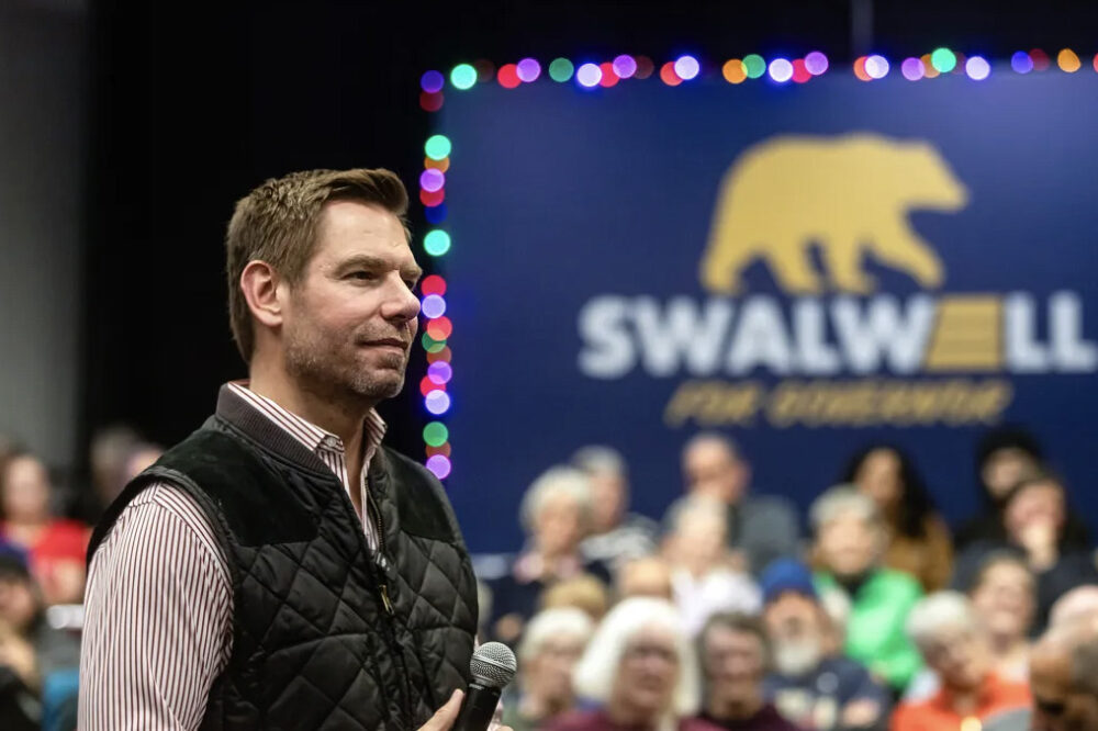 U.S. Rep. Eric Swalwell listens to questions from the audience during a town hall at the Fresno Convention & Entertainment Center in downtown Fresno on Dec. 15, 2025. Photo by Larry Valenzuela, CalMatters/CatchLight Local