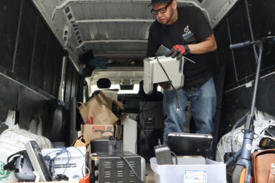 Oscar Ramirez sorts through the technology at the 3rd annual shred and tech toss at Congregation Beth Shalom in Santa Clarita, Calif., Sunday, April 26, 2026. Kamryn Martell/The Signal