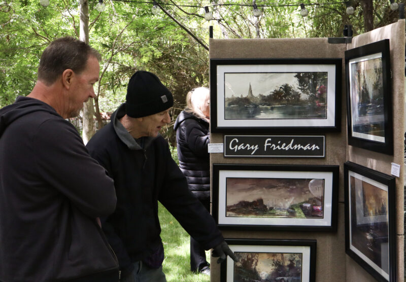 Kevin Lundby (L) speaks with featured artist Gary Friedman at the 12th annual Santa Clarita Artists Association's Spring Art Show at Le Chene French Cuisine in Santa Clarita, Calif., Sunday, April 26, 2026. Kamryn Martell/The Signal