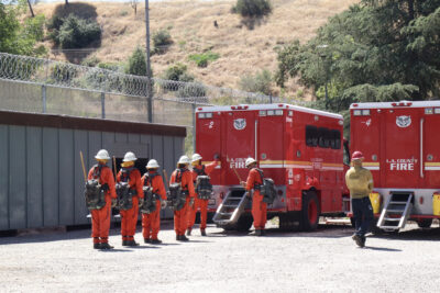 The inmates of graduating class 64 performs their drills at the Inmate Fire Training Program graduation ceremony at Pitchess Detention Center in Castaic, Calif., Wednesday, April 29, 2026. Kamryn Martell/The Signal