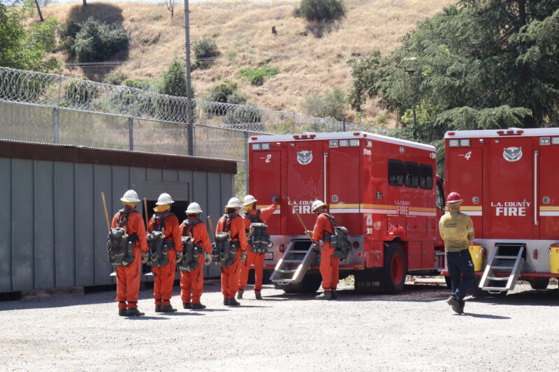 The inmates of graduating class 64 performs their drills at the Inmate Fire Training Program graduation ceremony at Pitchess Detention Center in Castaic, Calif., Wednesday, April 29, 2026. Kamryn Martell/The Signal