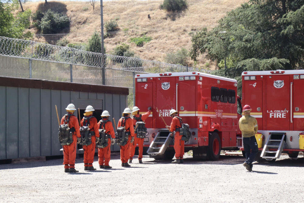 The inmates of graduating class 64 performs their drills at the Inmate Fire Training Program graduation ceremony at Pitchess Detention Center in Castaic, Calif., Wednesday, April 29, 2026. Kamryn Martell/The Signal