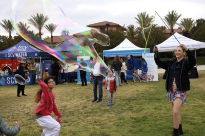 Jocelyn Ketsdever (R), owner of Fire Lily Entertainment, plays with bubbles at the city of Santa Clarita's 5th annual "FestAbility" at West Creek Park in Valencia, Calif., Sunday, May 3, 2026. Kamryn Martell/The Signal