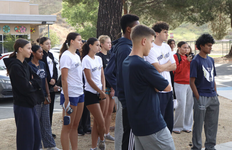 The West Ranch High School Track and Field team listens to the opening remarks at the fourth annual West Ranch High "Run With Dogs" event at the Santa Clarita Valley Animal Care Center in Castaic, Calif., Sunday, May 17, 2026. Kamryn Martell/The Signal