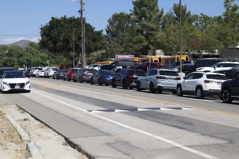 Cars park alongside the street during school pickup at Sulphur Springs Community School in Canyon Country, Calif., Thursday, May 21, 2026. Kamryn Martell/The Signal