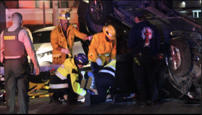 First responders were dispatched to a call of a woman who was trapped in her vehicle on Mandan Street and Soledad Canyon Road in Canyon Country, Calif. Photo courtesy of Dillon Foster/For The Signal