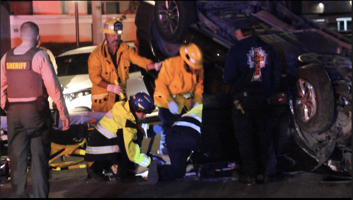 First responders were dispatched to a call of a woman who was trapped in her vehicle on Mandan Street and Soledad Canyon Road in Canyon Country, Calif. Photo courtesy of Dillon Foster/For The Signal