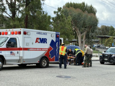 First responders help a girl after being hit by a car on the 27300 block of Catala Avenue in Saugus, Calif., Wednesday, May 27, 2026. Kamryn Martell/The Signal