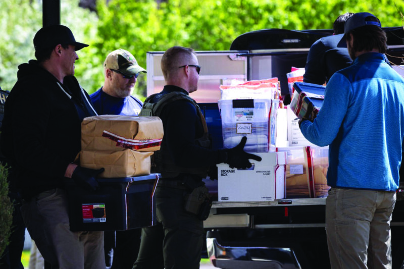 Federal and state officials load evidence into a vehicle as they execute a search warrant at The Original Childcare Center in south Minneapolis on April 28, 2026. Ben Hovland/Minnesota Public Radio via AP