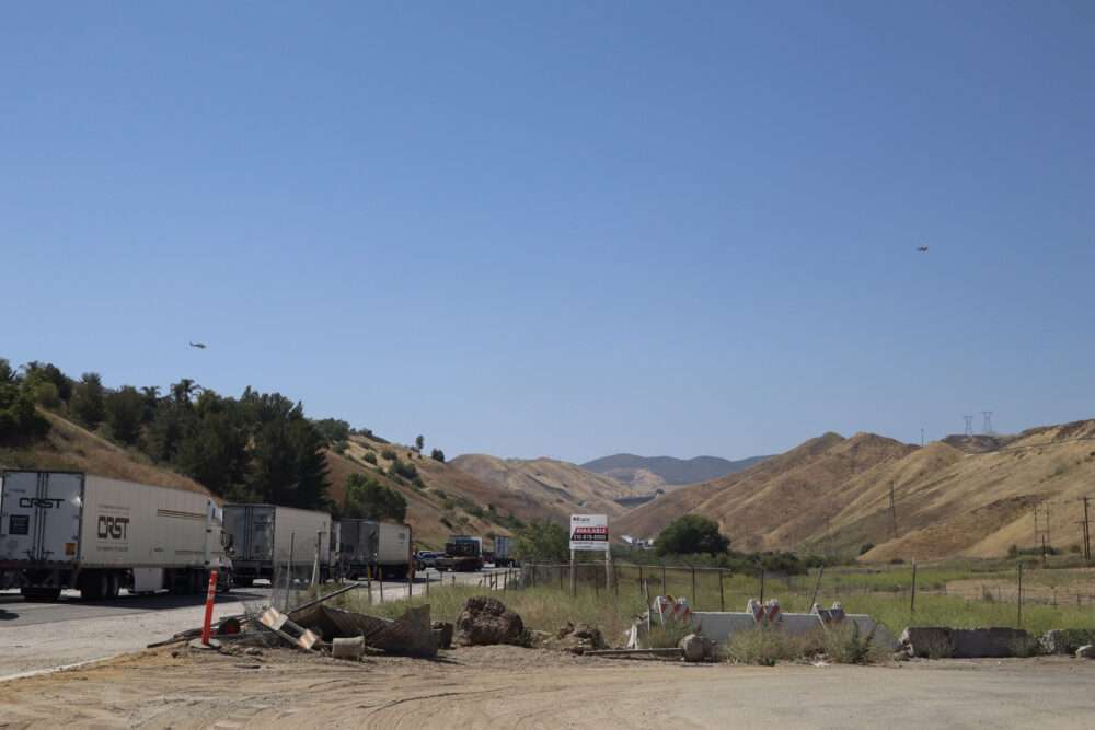 Helicopters circle the area of the "Cactus Fire" in Castaic, Calif., Monday, June 1, 2026. Kamryn Martell/The Signal