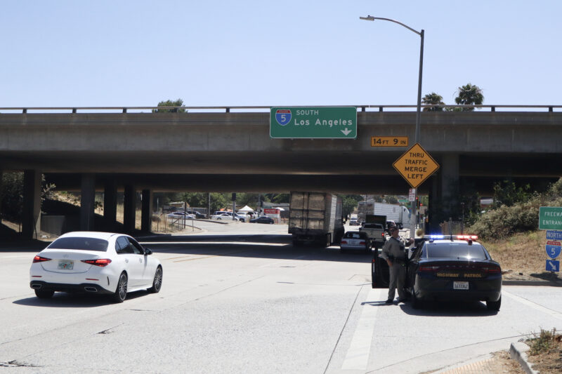 California Highway Patrol Newhall-area officers redirect traffic after the "Cactus Fire" broke out in Castaic, Calif., Monday, June 1, 2026. Kamryn Martell/The Signal