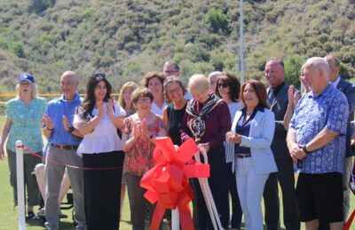 Local officials and the March family joined Mayor Laurene Weste on the baseball field for the Ribbon Cutting ceremony at David March Park on June 1, 2026. Sara McCarthy/ The Signal 