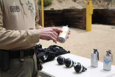 A sgt. shows a can of smoke used as tactical tool at the Los Angeles Sheriff's Department Sheriff's Response Team training at Pitchess Detention Center in Castaic, Calif., Thursday, May 28, 2026. Kamryn Martell/The Signal