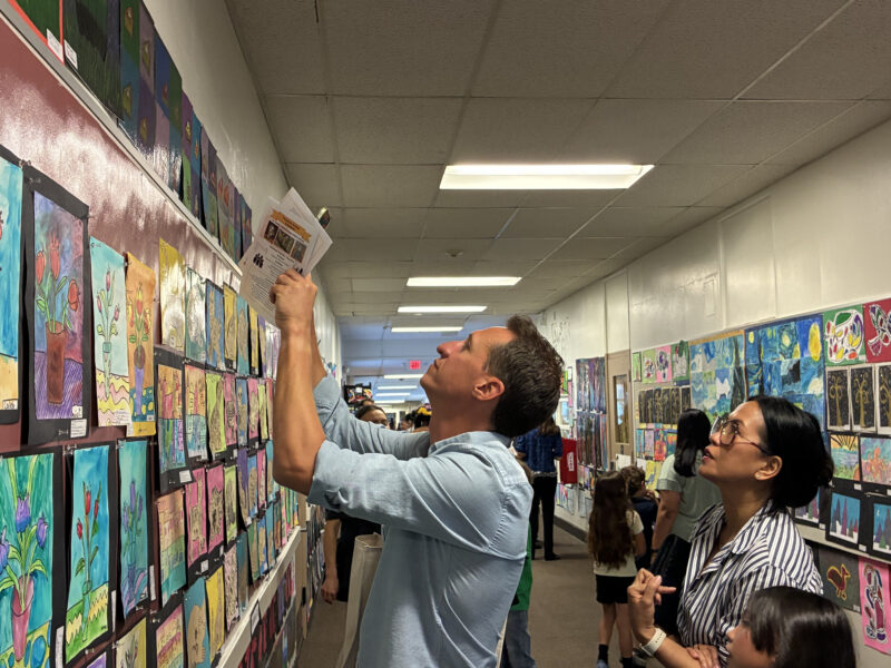 Attendees take photos of artwork at "Celebration of the Arts" at Newhall Elementary School in Newhall, Calif., Thursday, June 4, 2026. Kamryn Martell/The Signal