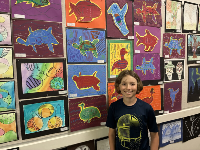 Jonah Levine, 12, smiles with his artwork at "Celebration of the Arts" at Newhall Elementary School in Newhall, Calif., Thursday, June 4, 2026. Kamryn Martell/The Signal