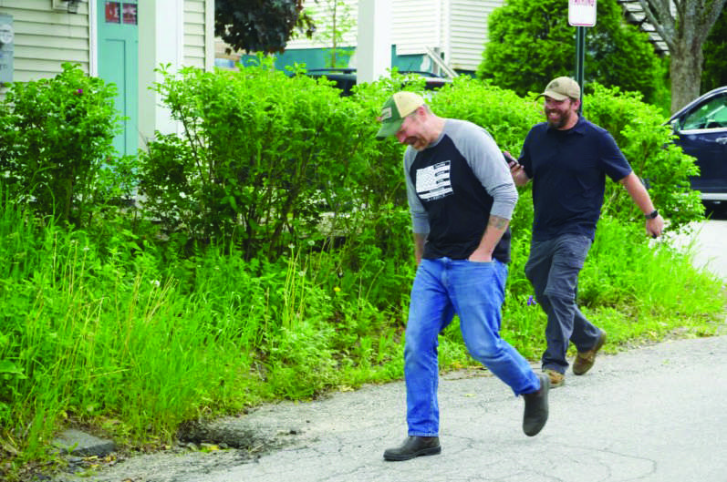 Graham Platner and a staffer leave a campaign event in Belfast, Maine, on June 6, 2026, just days ahead of the state's June 9 primary. The boutique oysterman and U.S. Marine Corps veteran hopes to oust Sen. Susan Collins (R-Maine) in November. Photo by Nathan Worcester.