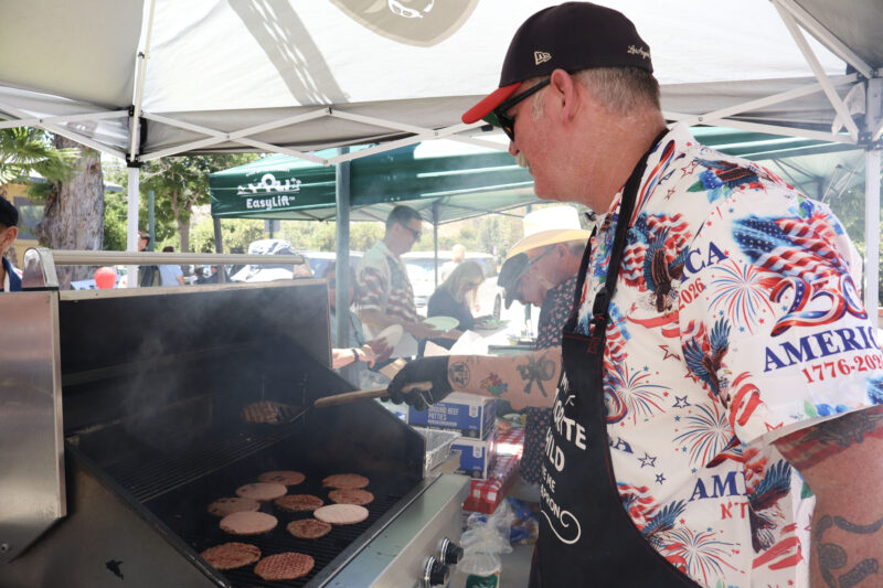Brian Frost grills hamburgers for attendees at the America 250 All-American BBQ at Veterans of Foreign Wars Post 6885 in Canyon Country, Calif., Sunday, June 14, 2026. Kamryn Martell/The Signal