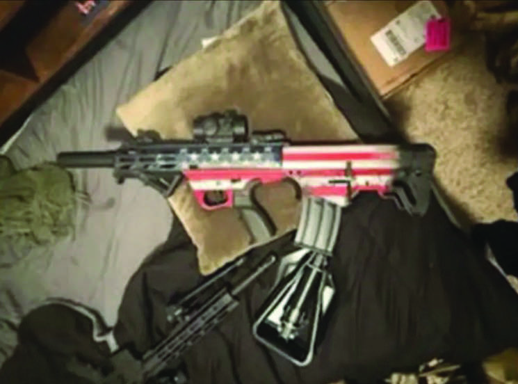 Tycen Proper allegedly acquired an AR-style rifle and a bullpup rifle painted with the American flag, officials said. Photo courtesy of the Department of Justice.