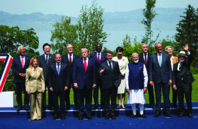 U.S. President Donald Trump, French President Emmanuel Macron, Canadian Prime Minister Mark Carney, Italian Prime Minister Giorgia Meloni, Japanese Prime Minister Sanae Takaichi, European Commission President Ursula von der Leyen, European Council President Antonio Costa, German Chancellor Friedrich Merz, Egyptian President Abdel Fattah al-Sisi, South Korea's President Lee Jae Myung, India's Prime Minister Narendra Modi, Brazilian President Luiz Inacio Lula da Silva, Kenya's President William Ruto and British Prime Minister Keir Starmer pose for a family photo during the G7 summit in Evian-les-Bains, France, on June 16, 2026. Isabel Infantes - Pool /Getty Images