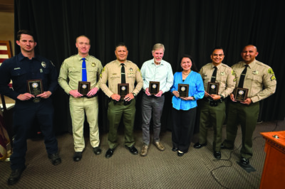 The honorees at the Elks Lodge Community Awards Night included, from left: L.A. County Firefighter Troy Anaya, California Highway Patrol Officer Christopher Penza, Sheriff’s Detective Steve Perez, Senior Center Volunteer of the Year Bill Pawlak, Henry Mayo service award recipient Gilda Cruz-Manglapus, Sheriff’s Detective David Ibanez, and Sheriff’s Deputy Mario Acosta. Courtesy photo.