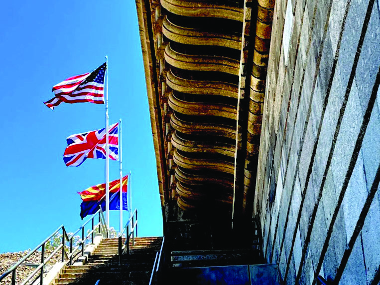 The flags of the United States, England, and Arizona stand above the London Bridge in Lake Havasu City, Ariz., on June 5, 2026. Photo by Allan Stein.