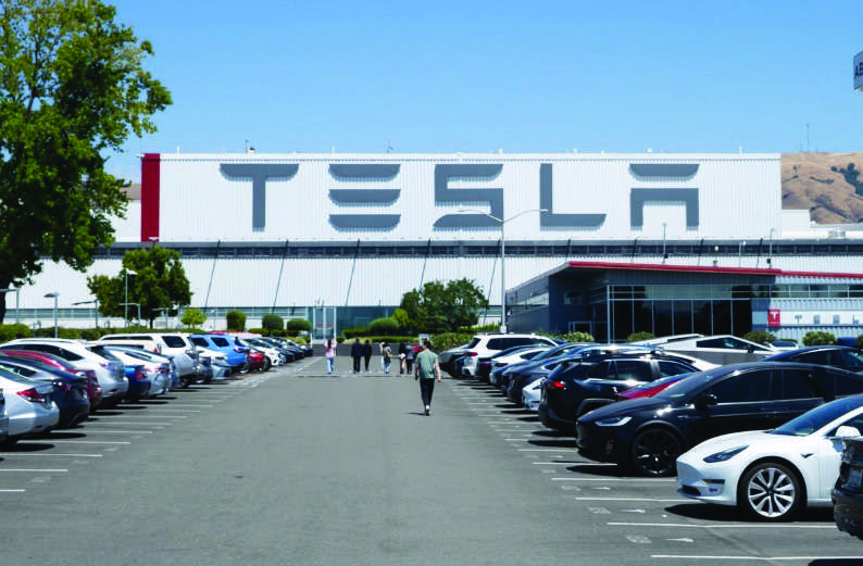 Tesla cars sit parked in a lot at the company’s factory in Fremont, Calif., on July 26, 2025. File photo by Gary Wang.