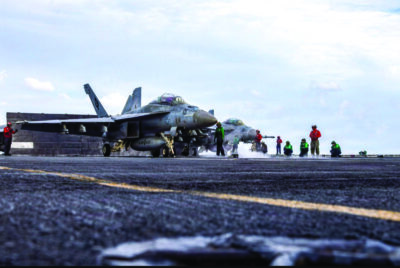Two F/A-18E Super Hornets, attached to Strike Fighter Squadron (VFA) 41, prepare to launch from the flight deck of Nimitz-class aircraft carrier USS Abraham Lincoln during Operation Epic Fury, March 31, 2026. U.S. Navy photo