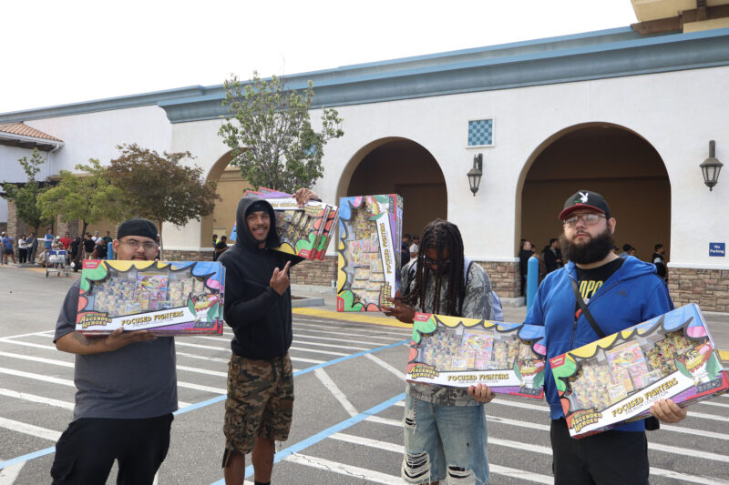 People pose for a photo with their Pokémon sets at Sam's Club, Tuesday, July 21, 2026. Kamryn Martell/The Signal