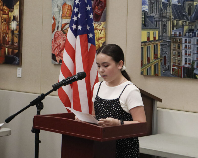 Charlie LeRoy, 11, speaks to the crowd at the inaugural National Parents Day awards ceremony at the Old Town Newhall Library in Newhall, Calif., Sunday, July 26, 2026. Kamryn Martell/The Signal