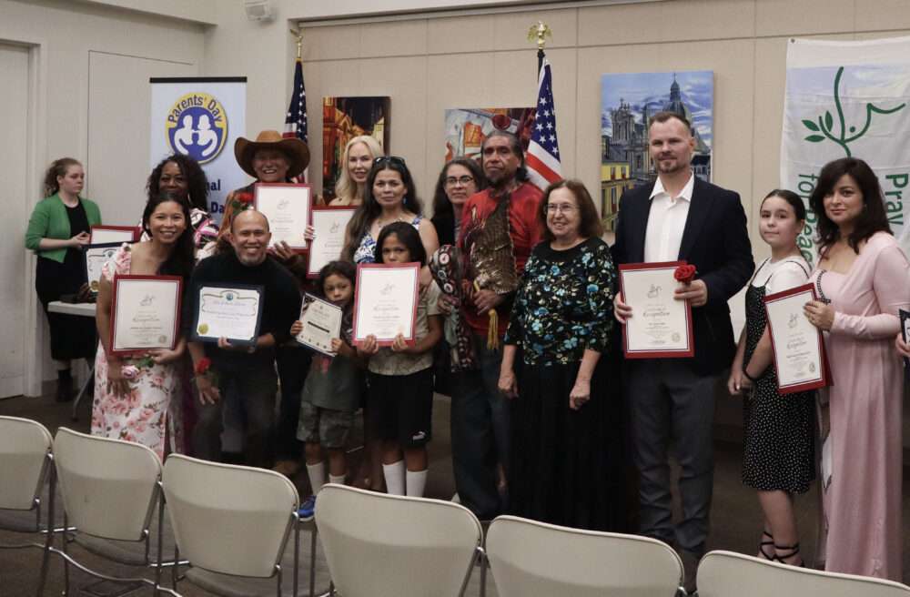 Honorees and community members pose for a photo at the inaugural National Parents Day awards ceremony at the Old Town Newhall Library in Newhall, Calif., Sunday, July 26, 2026. Kamryn Martell/The Signal