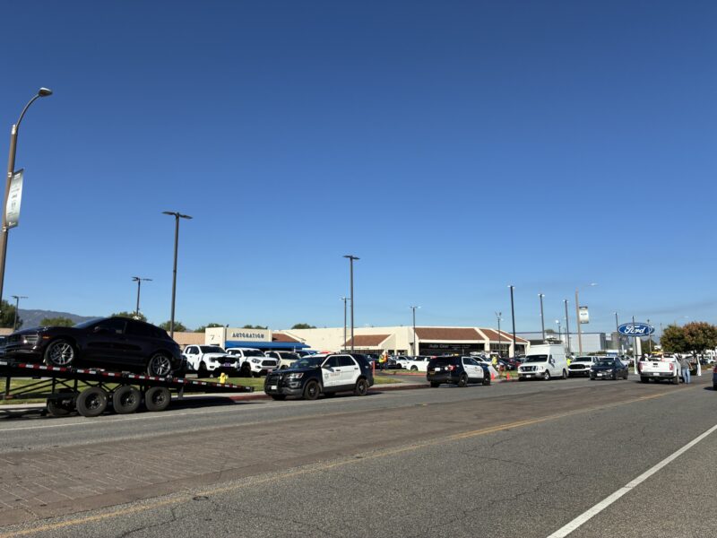 Santa Clarita Valley Sheriff's Station personnel sit in front of the Ford dealership after the "Creekside Fire" on the 23900 block of Creekside Drive in Valencia, Calif., Thursday, July 30, 2026. Kamryn Martell/The Signal