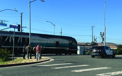 A Metrolink commuter train stuck a reportedly unoccupied car on the tracks late Monday afternoon, prompting a closure of the commuter rail line between the Santa Clarita and Antelope valleys and snarling traffic along Soledad Canyon Road just west of Canyon Country.  Signal Staff Photo.
