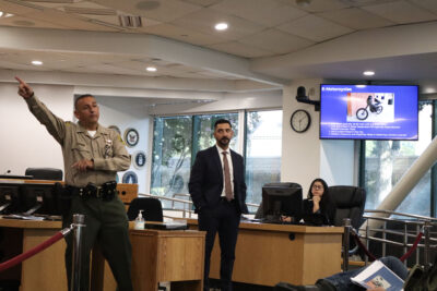 Lt. Guillermo Martinez (L) and Masis Hagobian (R) give a presentation on electric bikes and motorcycles at Santa Clarita's City Hall, Tuesday, Aug. 4, 2026. Kamryn Martell/The Signal