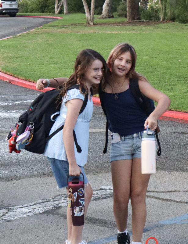 Caiya Campbell (L), 10, and Brielle Peterson, 10, hug on the first day of school at Highlands Elementary School in Saugus, Calif., Wednesday, Aug. 12, 2026. Kamryn Martell/The Signal