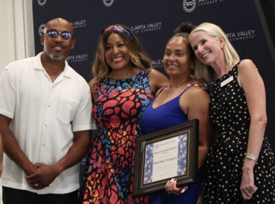 From left: Steven Barlow, Di Thompson, Nedra Barlow and Jennifer Abbott Aston smile for a photo at the Santa Clarita Valley Chamber of Commerce's fourth annual Black Business Month event at the California Institute of the Arts, Thursday, Aug. 6, 2026. Kamryn Martell/The Signal