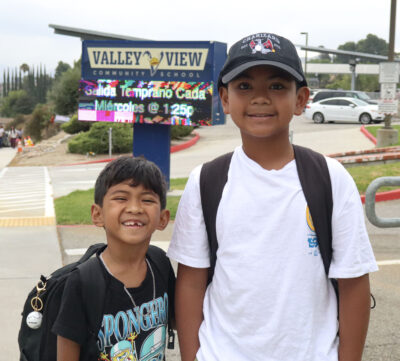 From left: Eli Cruz, 8, and Ian Cruz, 11, smile for a photo on the first day at Valley View Community School in Newhall, Calif., Thursday, Aug. 13, 2026. Kamryn Martell/The Signal