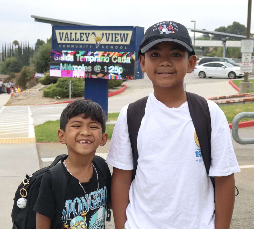 From left: Eli Cruz, 8, and Ian Cruz, 11, smile for a photo on the first day at Valley View Community School in Newhall, Calif., Thursday, Aug. 13, 2026. Kamryn Martell/The Signal