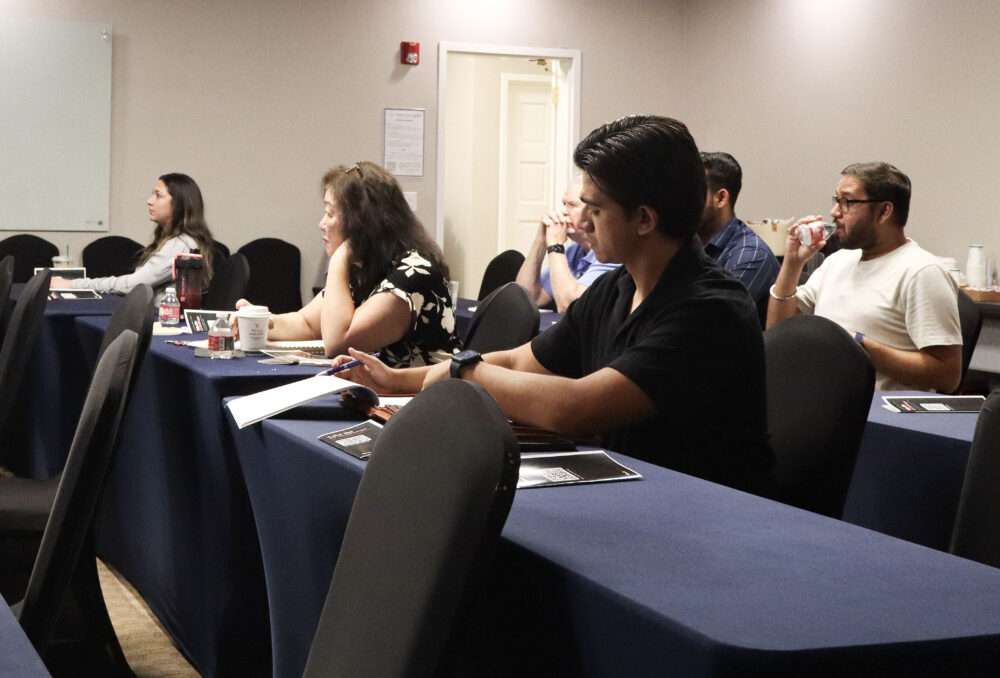 Attendees listen at the Santa Clarita Valley Chamber of Commerce's "The AI Advantage" seminar at 360 Suites SCV in Stevenson Ranch, Calif., Tuesday, Aug. 18, 2026. Kamryn Martell/The Signal